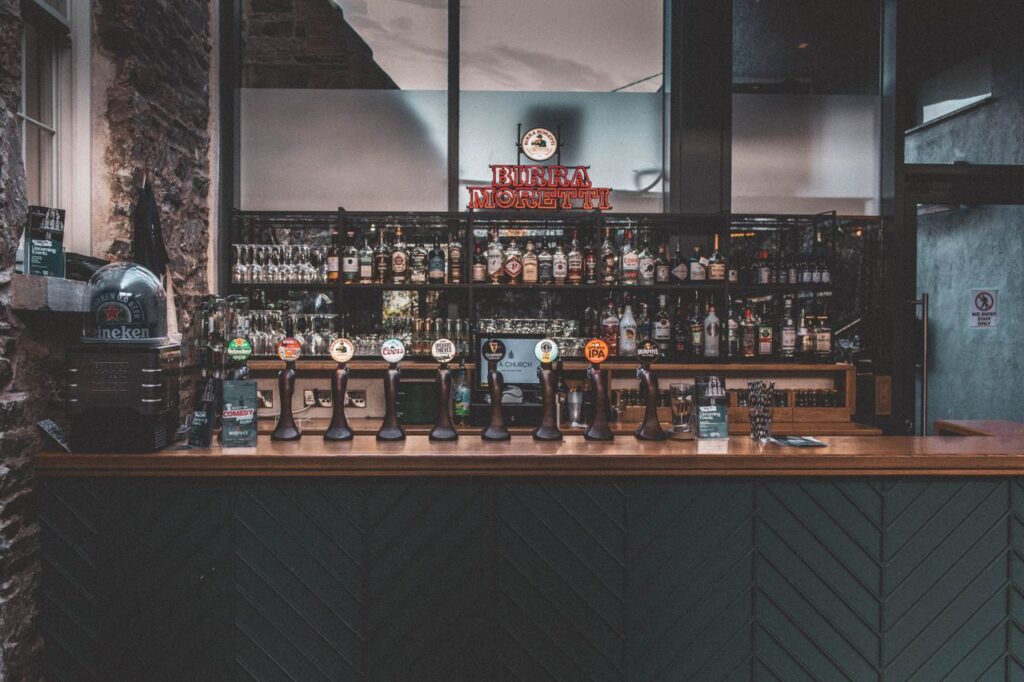 Warm and inviting Irish pub with a rustic bar setup in Ballycotton, County Cork.